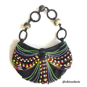 ANNA TRZEBINSKI SUEDE W/. AFRICAN BEADS AND COW HORN CLUTCH